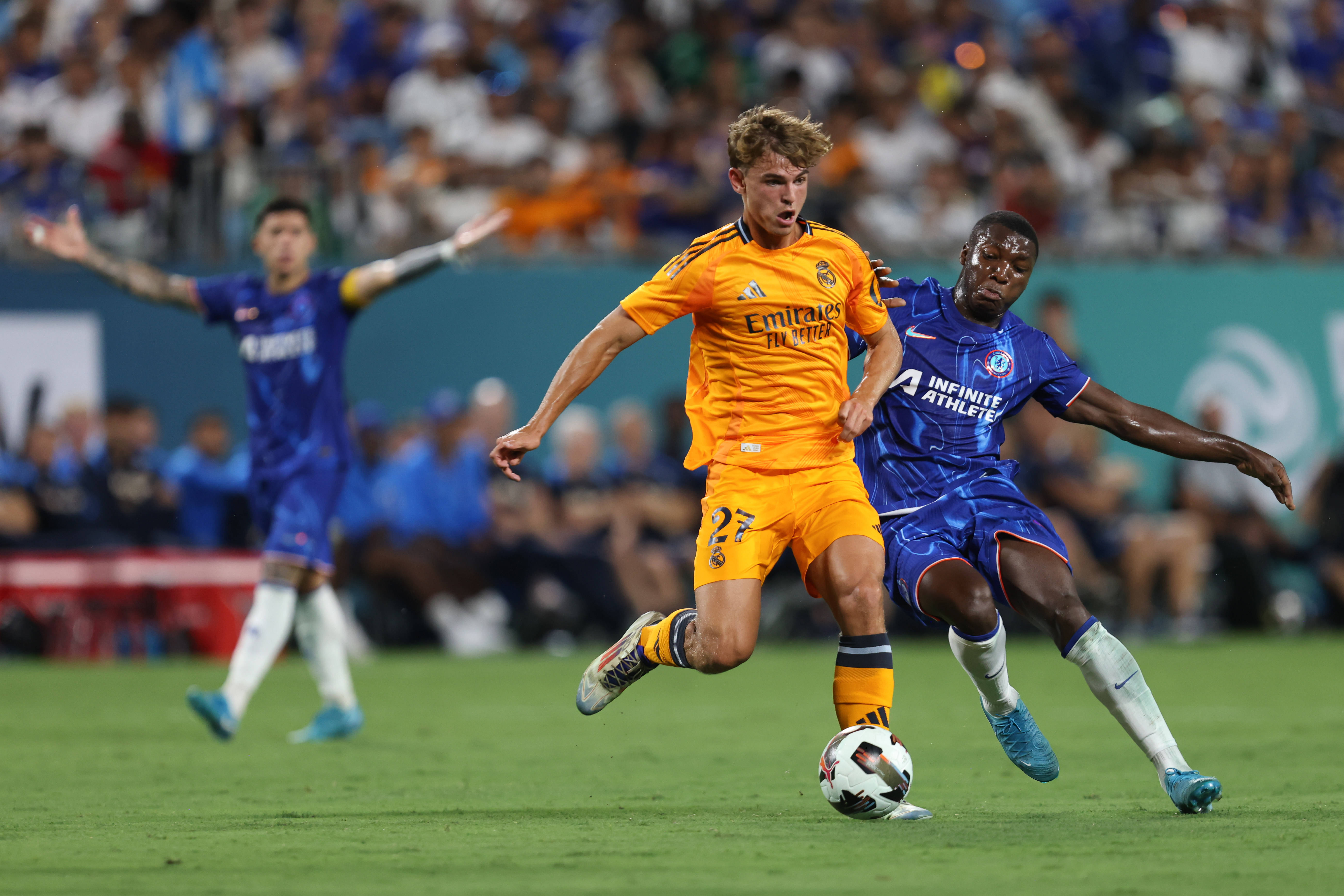 August 6, 2024: Real Madrid midfielder Nico Paz (27) is challenged by Chelsea midfielder Moiso s Caicedo (25) during the